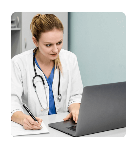 Healthcare employee working on a laptop using TimeBee to track time
